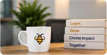 A bee mug beside books about learning, growth, and creating impact together